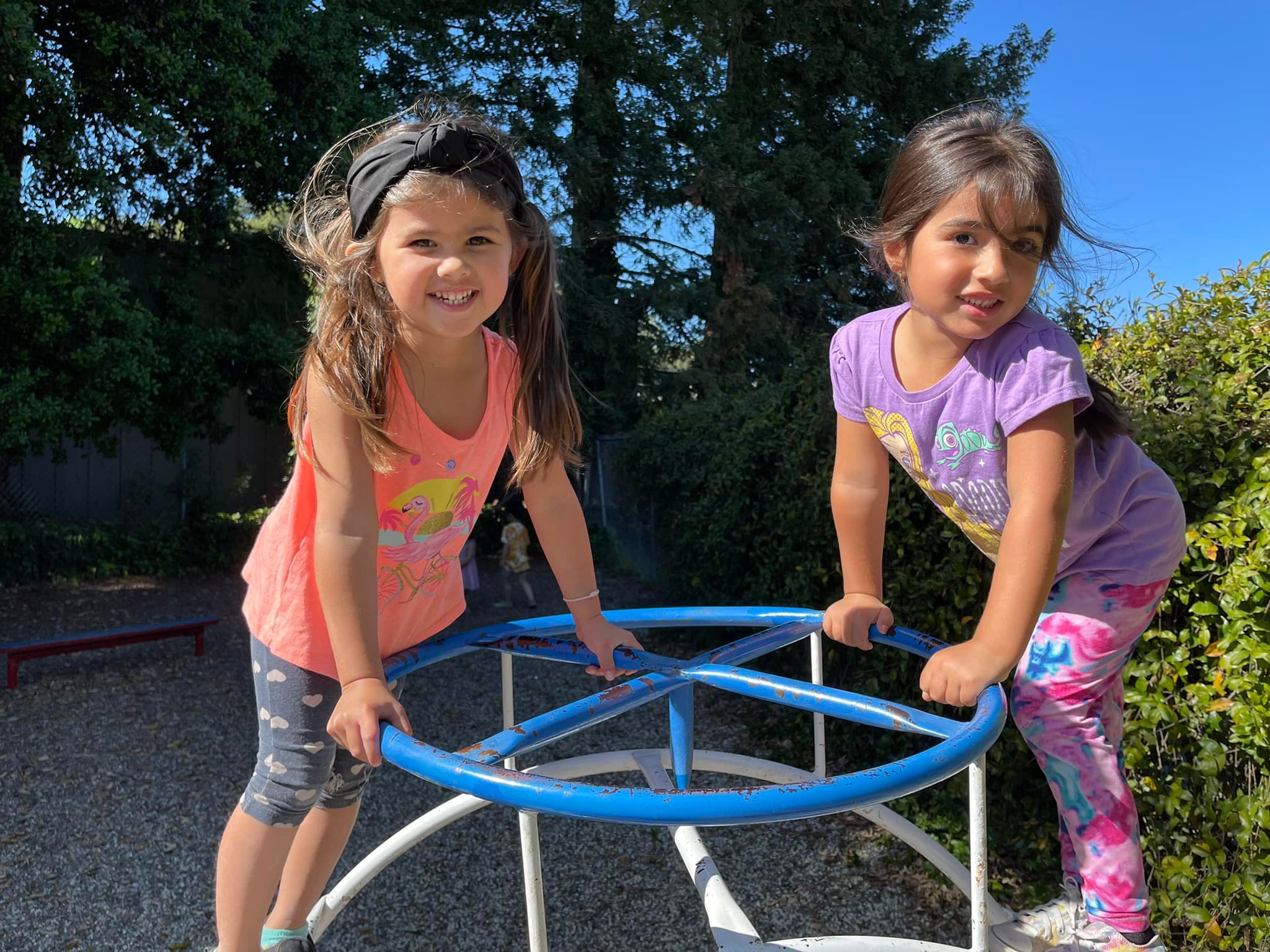 Two girls on roundabout